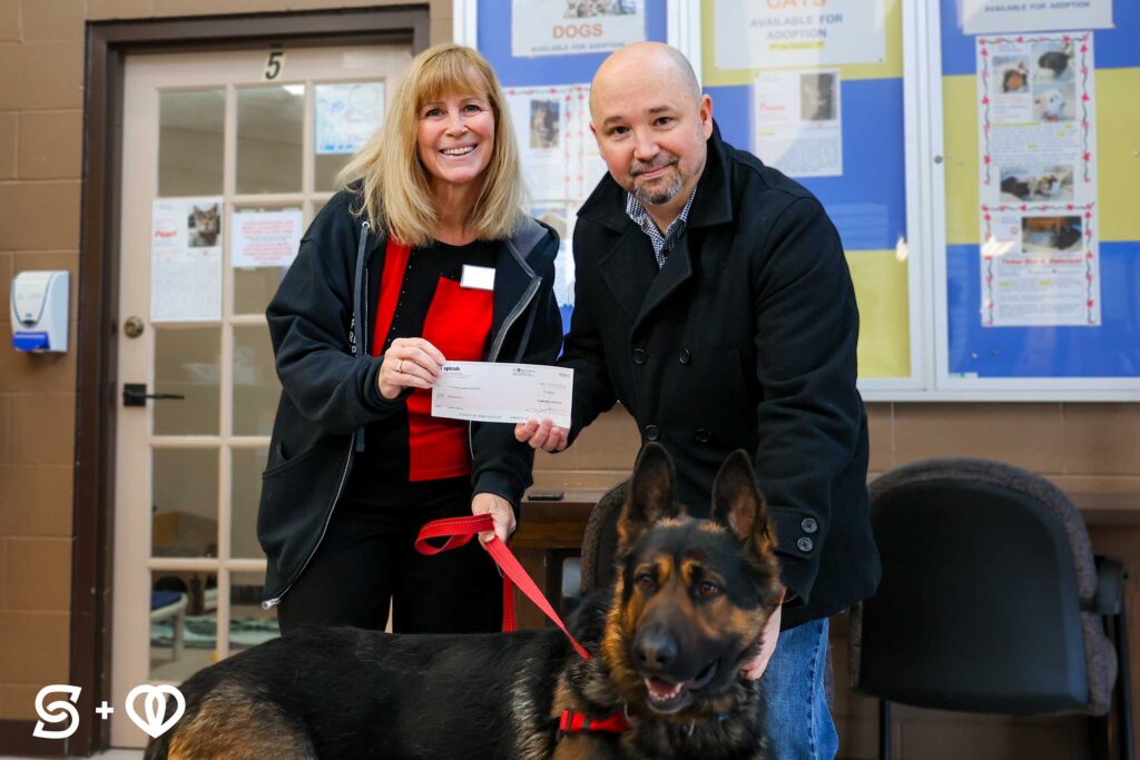 Michael from Splash Media Group, presenting the donation check to SPCA staff